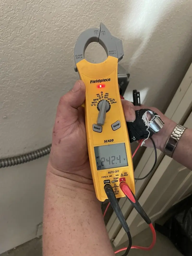 Voltage testing with clamp meter during Hot Tub / Pool Electrical Wiring in Perkins